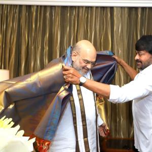 Megastar Chiranjeevi and Ram charan met with Amit Shah